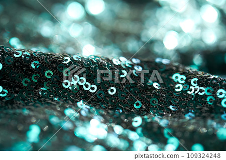 Christmas abstract background made of emerald green sequins. Christmas abstract background made of emerald green sequins. 109324248
