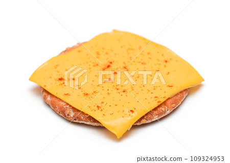 Crispy Cracker Sandwich with Cheese and Paprika - Isolation Crispy Cracker Sandwich with Cheese and Paprika - Isolation 109324953
