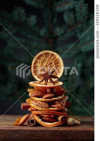 Christmas still-life with dried fruits and nuts. 109326309