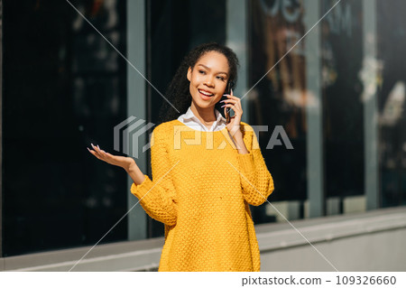 Working woman concept a female manager attending video conference and holding tablet, smatrphone and cup of coffee on street in city Outside . Working woman concept a female manager attending video conference and holding tablet, smatrphone and cup of coffee on street in city Outside . 109326660