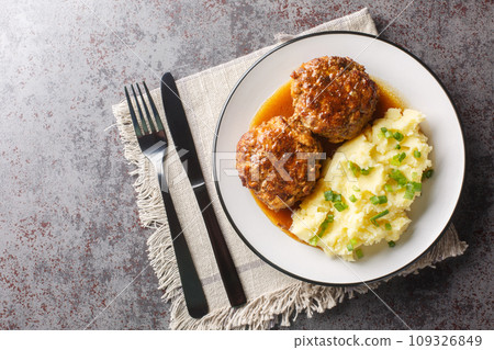 Dutch food a dish of meatballs gehaktballen served with mashed potatoes closeup on the plate. Horizontal top view Dutch food a dish of meatballs gehaktballen served with mashed potatoes closeup on the plate. Horizontal top view 109326849