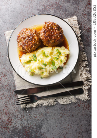 Hutspot met Gehaktballen Dutch Mashed Potatoes with Meatballs closeup on the plate. Vertical top view 109326852