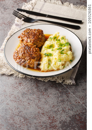 Hutspot met Gehaktballen Dutch Mashed Potatoes with Meatballs closeup on the plate. Vertical 109326861