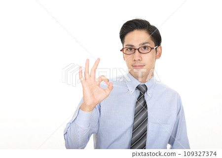 A man posing with an OK sign A man posing with an OK sign 109327374