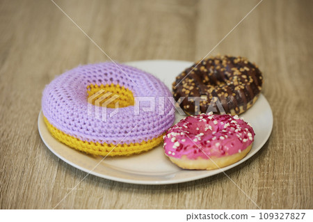 Cute toy near real on a plate Cute toy near real on a plate 109327827