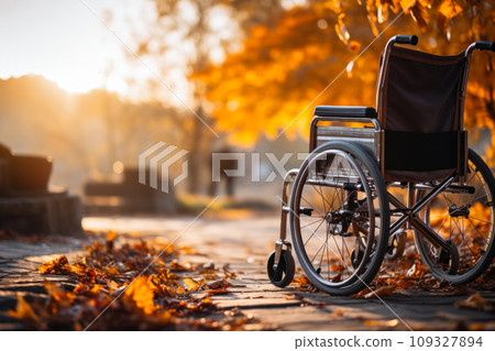 ensuring accessibility and ease of movement for people with limited mobility, a wheelchair stands in an autumn park, copied space for the concept ensuring accessibility and ease of movement for people with limited mobility, a wheelchair stands in an autumn park, copied space for the concept 109327894