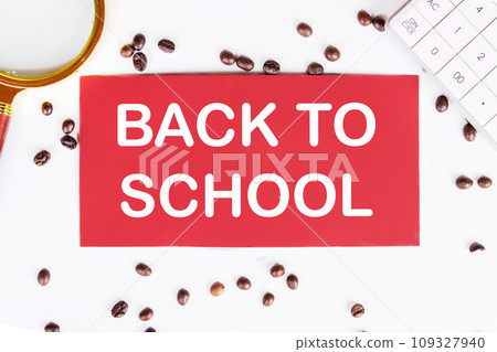 Back to school writing on a red card on a white background with coffee beans and a magnifying glass 109327940