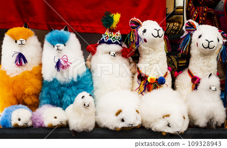 Display of fluffy plush toys made of baby alpaca wool, Pisac traditional market, Peru Display of fluffy plush toys made of baby alpaca wool, Pisac traditional market, Peru 109328943
