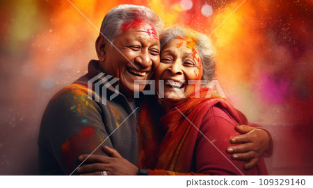 An elderly couple - a man and a woman with joyful faces at the celebration of the Holi festival. An elderly couple - a man and a woman with joyful faces at the celebration of the Holi festival. 109329140