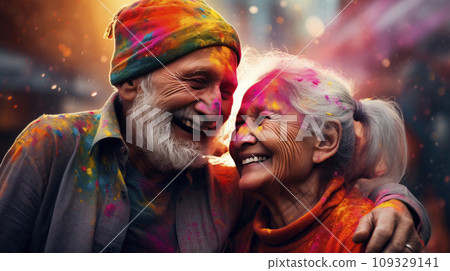 An elderly couple - a man and a woman with joyful faces at the celebration of the Holi festival. An elderly couple - a man and a woman with joyful faces at the celebration of the Holi festival. 109329141