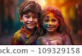 A boy and a girl with joyful faces at the celebration of the Holi festival.  109329158