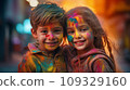 A boy and a girl with joyful faces at the celebration of the Holi festival.  109329160