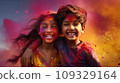 A boy and a girl with joyful faces at the celebration of the Holi festival.  109329164