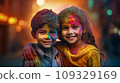 A boy and a girl with joyful faces at the celebration of the Holi festival.  109329169