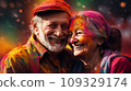 An elderly couple - a man and a woman with joyful faces at the celebration of the Holi festival.  109329174