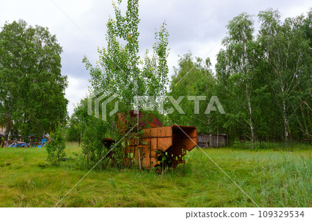 Abandoned agricultural machinery in former mechanized yard of state farm in resettled village of Pogonnoye in Chernobyl exclusion zone, Belarus Abandoned agricultural machinery in former mechanized yard of state farm in resettled village of Pogonnoye in Chernobyl exclusion zone, Belarus 109329534