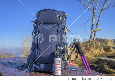 Climbing safety equipment: bear repellent spray, bear bell, beacon Climbing safety equipment: bear repellent spray, bear bell, beacon 109329890