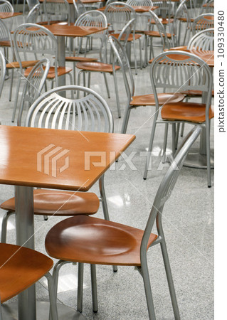 Tables and chairs in an empty cafe or restaurant Tables and chairs in an empty cafe or restaurant 109330480