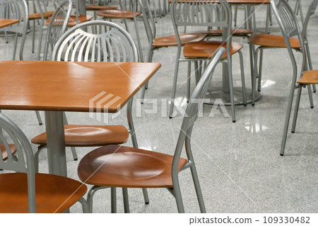 Tables and chairs in an empty cafe or restaurant 109330482