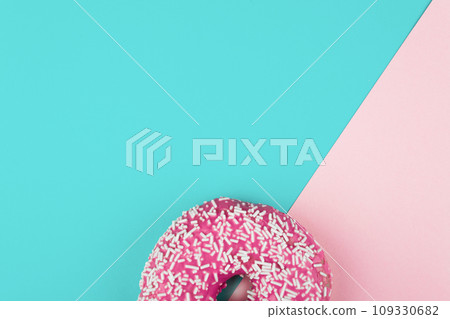 Pink donut on color background, flat lay, top view Pink donut on color background, flat lay, top view 109330682