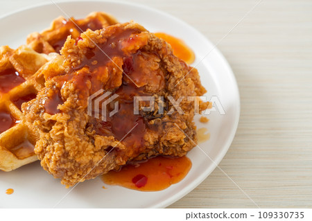 fried chicken with waffle and spicy sauce 109330735