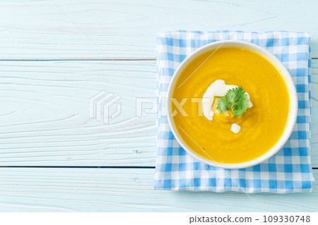 pumpkin soup in white bowl 109330748