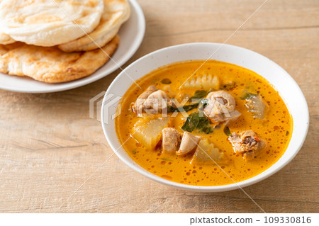 Chicken curry soup with roti Chicken curry soup with roti 109330816
