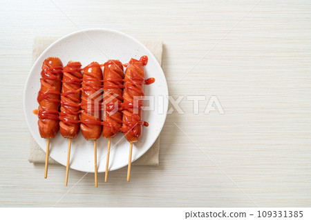 fried sausage skewer with ketchup 109331385