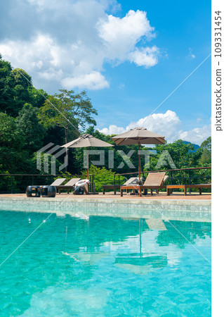 bed pool with umbrella around swimming pool bed pool with umbrella around swimming pool 109331454