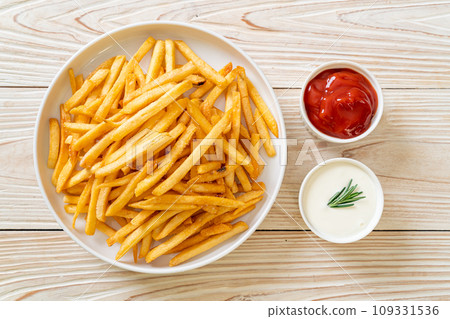 French fries with sour cream and ketchup French fries with sour cream and ketchup 109331536