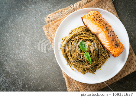 pesto spaghetti pasta with grilled salmon pesto spaghetti pasta with grilled salmon 109331657
