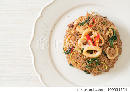 fried rice with squid and basil in Thai style fried rice with squid and basil in Thai style 109331754