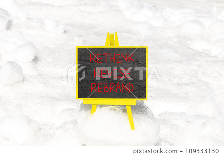 Rethink revise rebrand symbol. Concept word Rethink Revise Rebrand on beautiful blackboard. Beautiful white snow background. Business brand motivational rethink revise rebrand concept. Copy space. 109333130