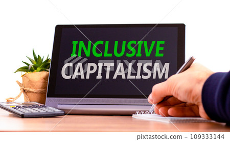 Inclusive capitalism symbol. Concept words Inclusive capitalism on beautiful black tablet. Beautiful white background. Calculator. Businessman hand. Business inclusive capitalism concept. Copy space. Inclusive capitalism symbol. Concept words Inclusive capitalism on beautiful black tablet. Beautiful white background. Calculator. Businessman hand. Business inclusive capitalism concept. Copy space. 109333144