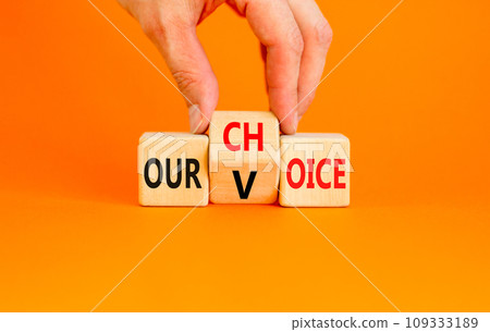 Our voice choice symbol. Businessman turns wooden cube and changes concept word Our choice to Our voice. Beautiful orange table orange background, copy space. Business and our voice choice concept Our voice choice symbol. Businessman turns wooden cube and changes concept word Our choice to Our voice. Beautiful orange table orange background, copy space. Business and our voice choice concept 109333189
