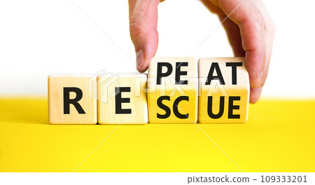 Rescue and repeat symbol. Concept words Rescue Repeat on wooden block. Beautiful yellow table white background. Businessman hand. Business rescue and repeat concept. Copy space. 109333201