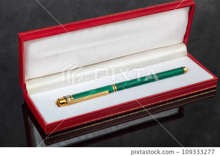 Fountain pen on marble and gray background. Gift concept. Fountain pen on marble and gray background. Gift concept. 109333277