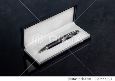 Fountain pen on marble and gray background. Gift concept. Fountain pen on marble and gray background. Gift concept. 109333294