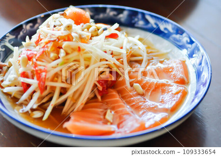 spicy salmon salad or spicy salad , fish salad or salmon salad or som tam or salmon and papaya salad spicy salmon salad or spicy salad , fish salad or salmon salad or som tam or salmon and papaya salad 109333654