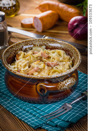 Pasta with sauerkraut and sausage. Pasta with sauerkraut and sausage. 109333673
