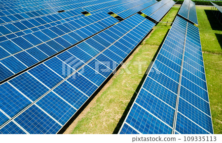 Aerial view of Solar Panels Farm Solar Cell Station. Production of clean energy. Renewable green alternative energy concept. Aerial view of Solar Panels Farm Solar Cell Station. Production of clean energy. Renewable green alternative energy concept. 109335113