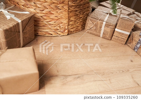 A close-up view of the gift boxes near the Christmas tree. The concept of waiting for gifts with space to copy. High quality photo A close-up view of the gift boxes near the Christmas tree. The concept of waiting for gifts with space to copy. High quality photo 109335260