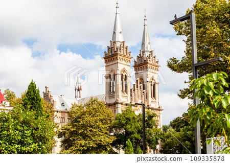 view of towers of Batumi Cathedral over green tree 109335878