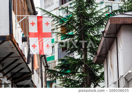 Georgian flag on balcony of residential building Georgian flag on balcony of residential building 109336035