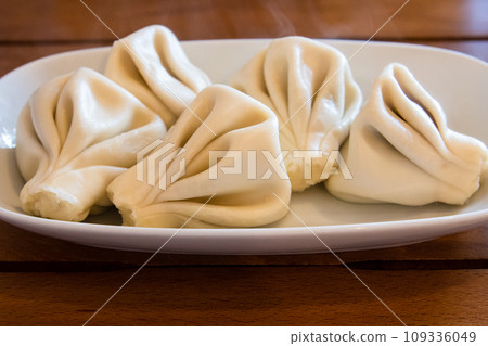 boiled Khinkali (Georgian dumpling) closeup boiled Khinkali (Georgian dumpling) closeup 109336049