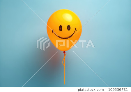 Yellow baloon with a painted smile on background. Holiday. Birthday. 109336781