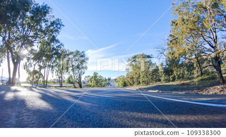 During the day, driving on HWY 101 near Arroyo Quemada Beach, California, offers scenic views of the surrounding coastal landscape. 109338300