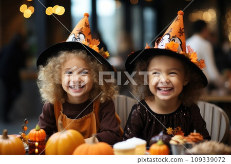 Children Trick Or Treating with Jack-O-Lantern Candy Buckets on Halloween 109339072