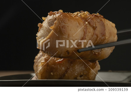 Meat-wrapped rice ball with chopsticks 109339139