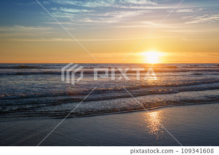 Atlantic ocean sunset with surging waves at Fonte da Telha beach, Costa da Caparica, Portugal Atlantic ocean sunset with surging waves at Fonte da Telha beach, Costa da Caparica, Portugal 109341608